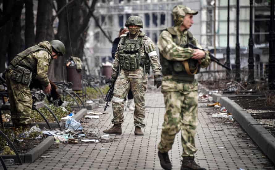 Russian soldiers in the streets of Mariupol.