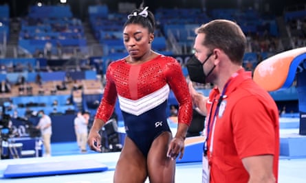 Simone Biles reacts after her opening vault – shortly afterwards she withdrew.