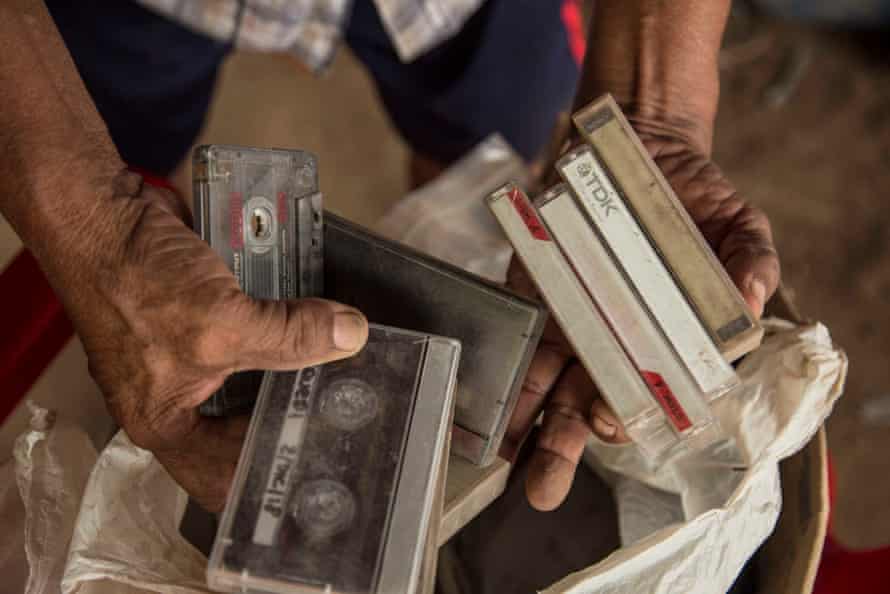 Chiqueno holding some of the thousands of tapes he has recorded of the Ayoreo people