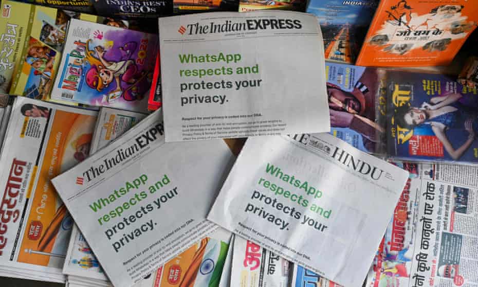 An advertisement from WhatsApp is seen in a newspaper at a stall in New Delhi 