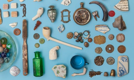 A collection of historical artefacts found on the banks of the river Thames, laid out on a blue background