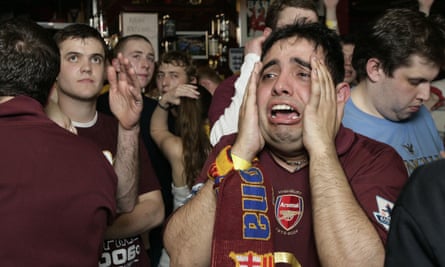 Arsenal fans watch their team lose the 2006 Champions League final to Barcelona at the Gunners pub in Highbury.