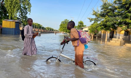 People on a flooded road