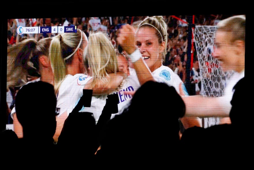 Supporters in the Trafalgar Square fanzone celebrate after Fran Kirby scored England’s fourth goal.