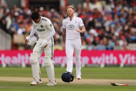 Shubman Gill reacts after being hit on the hand by a ball bowled by Ben Stokes.