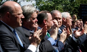 White House Director of the National Economic Council Gary Cohn, Chief Strategist Steven Bannon, Chief of Staff Reince Priebus, EPA Administrator Scott Pruitt and Vice President Mike Pence applaud as US President Donald Trump announces his decision to withdraw from the Paris Climate Agreement. Rose Garden, White House, Washington, 1 June 2017. REUTERS/Joshua Roberts