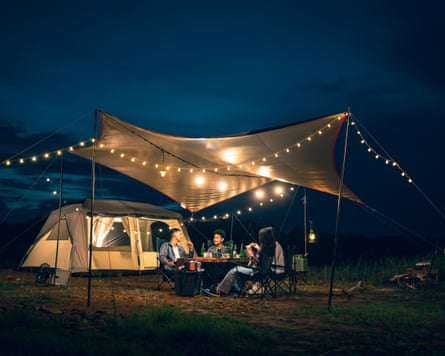 Groups of friends and couples having a drink party in a camping atmosphere amid forests and rivers.