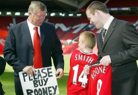 Rooney and Sir Alex Ferguson with a young fan at the striker’s Manchester United unveiling