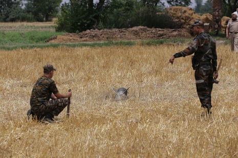 Indian service personnel secure the site where missile debris was found in a field near Amritsar, India on 8 May.