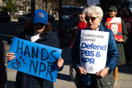 people holding protest signs