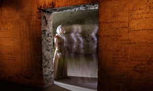 The ghostly figure of a woman seen in a doorway in The Real Mary King’s Close tourist attraction, Edinburgh, Scotland.