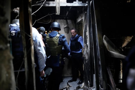 David Cameron viewing a house destroyed at Kibbutz Be’eri in the Hamas attack last month.