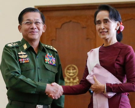 Aung San Suu Kyi shakes hands with Myanmar’s military commander-in-chief Min Aung Hlaing (left) in December 2015. Photograph: Lynn Bo Bo/EPA