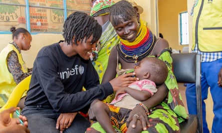 Vanessa Nakate (left) talks with Christine Lokotor and her 11-month-old daughter, Apua Akadoli, at the Kobuin health facility in Turkana, Kenya.