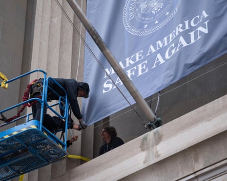 Workers setting up the Trump banner on Thursday.