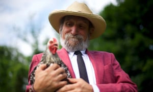 Gary Asteak, a civil rights attorney, holds one of his chickens.