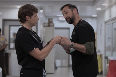 Two doctors doing a fist pump