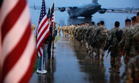 82nd airborne paratroopers march to board a civilian aircraft bound for the US Central Command area of operations from Fort Bragg, North Carolina, in 2020.
