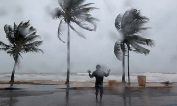 A man reacts in the winds and rain in Luquillo as Hurricane Irma slammed across islands in the northern Caribbean