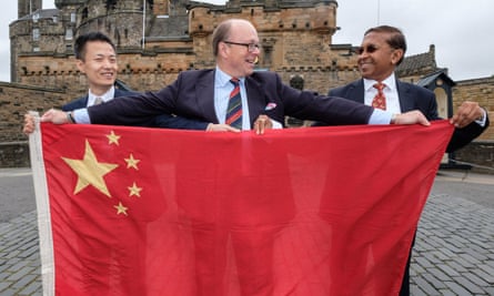 Brig David Allfrey (centre), CEO of Royal Edinburgh Military Tattoo, with Austin Xu and Sudhir Taparia of WeChat Pay, the Chinese online payment system.