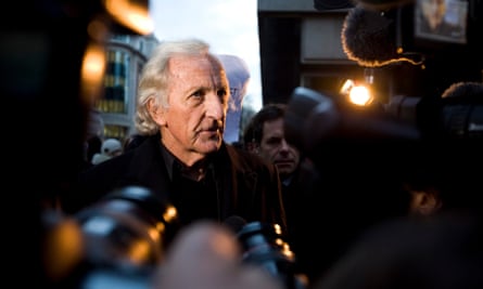 John Pilger talks to journalists outside Horseferry Road magistrates court in London in 2010