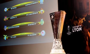 The match fixtures are displayed on an electronic panel next to the Europa League trophy following quarter final draw.