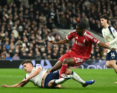 Liverpool's Alexander Isak is tackled by Tottenham defender Micky van de Ven
