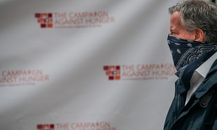 New York City’s mayor, Bill de Blasio, wears a bandana while visiting a food shelf organized by the Campaign Against Hunger in Brooklyn on 14 April in New York City.