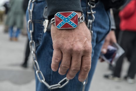 a confederate flag bracelet on a hand