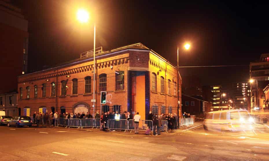 People queue outside the Factory nightclub in Manchester
