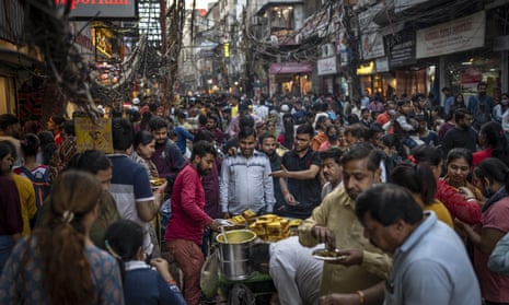 crowd of people at a food stand in New Delhi