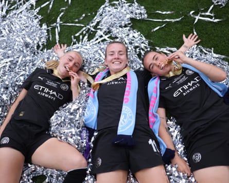 Laura Blindkilde Brown, Lauren Hemp and Grace Clinton of Manchester City celebrate after winning the FA Cup to seal the double