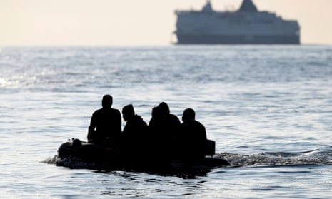 Migrants claiming to be from Darfur, Sudan crossing the Channel in an inflatable boat near Dover.