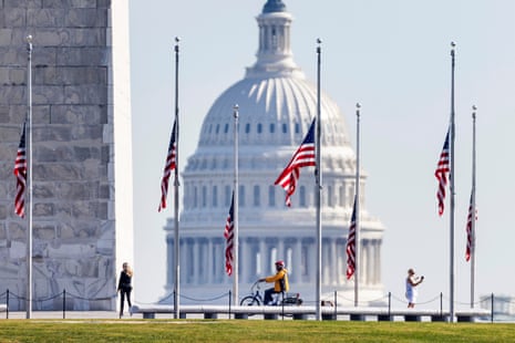 Flags fly at half-staff on the National Mall to honor victims of the October 25 mass-shooting in Lewiston Maine, where at least 18 people are dead and 13 injured, in Washington, DC, USA, 26 October 2023.