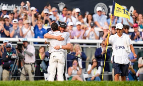 Michael Block hugs Rory McIlroy on the 18th green after the final round of the US PGA Championship