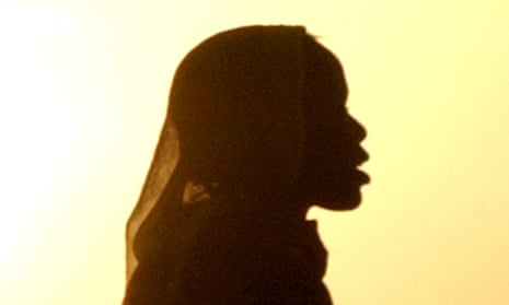 A Sudanese woman in silhouette