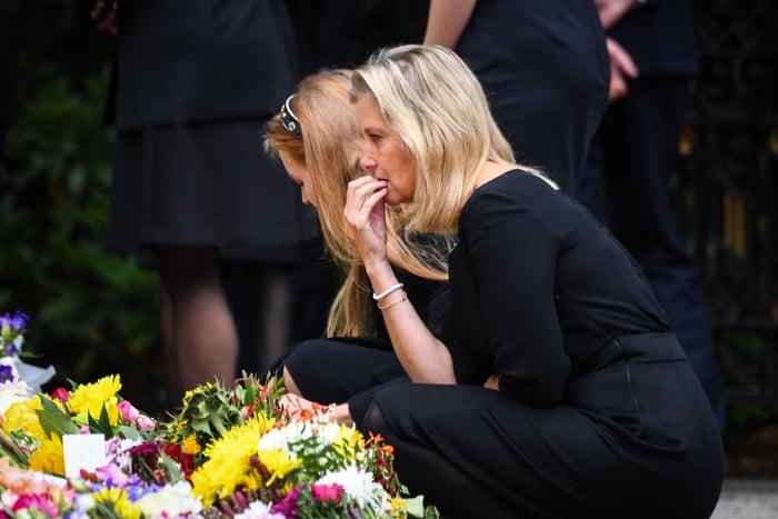 Princess Beatrice (left) and Sophie, Countess of Wessex look at the flowers placed outside Balmoral Castle.