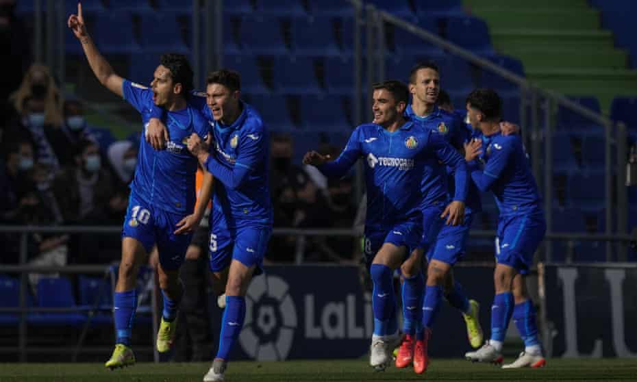 Getafe players celebrate after Enes Unal scored the only goal of the game at home against Real Madrid.