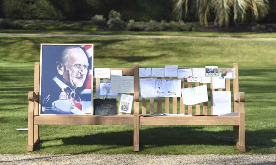 Tributes and messages left by members of the public outside Buckingham Palace, London.