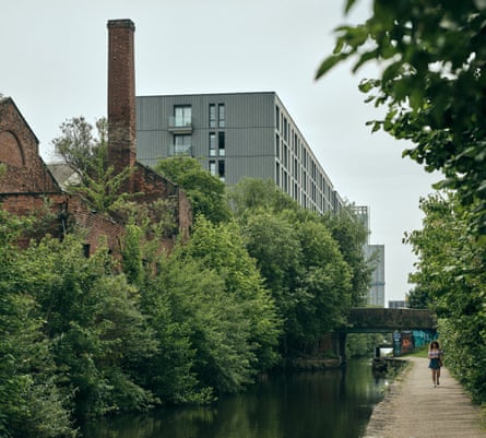a walker on the towpath of the Ashton canal (below) which flows through Miles Platting en route from Ashton-under-Lyne to central Manchester
