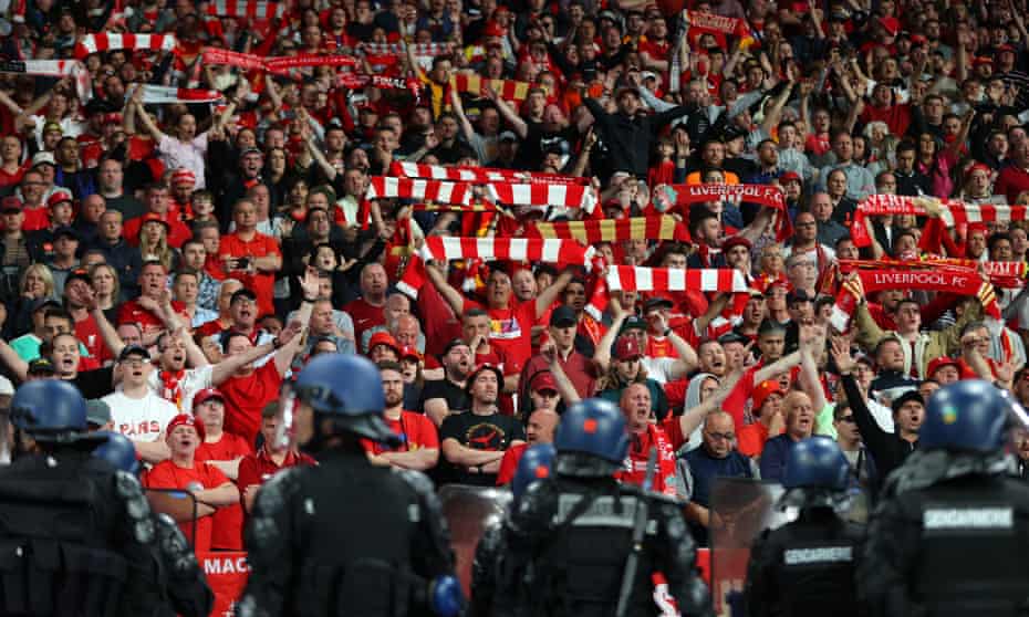 Riot police keep an eye on Liverpool fans at the Champions League final at the Stade de France.