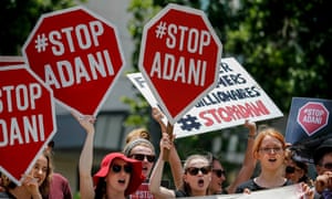 Protestors are seen outside the Queensland Resources Council annual lunch in Brisbane in 2017.