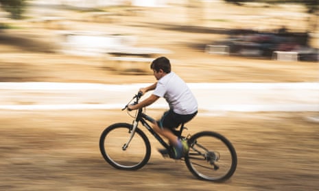 A boy riding a bike