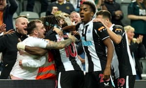 Newcastle fans celebrate with Allan Saint-Maximin after he got them back on level terms.