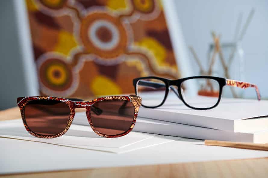 Two pairs of glasses on a table.