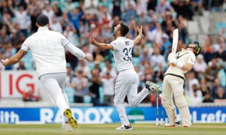 England's Mark Wood celebrates after taking the wicket of Australia's Marnus Labuschagne.