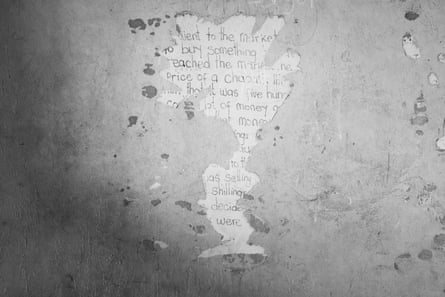 the remains of a poster on a wall