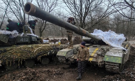 Ukrainian service personnel stand on their tanks near the frontline of Bakhmut in Donetsk region, Ukraine.