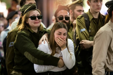 Family and friends react during the funeral for IDF Staff Sgt Boris Dunavetski in Tel Aviv, Israel.