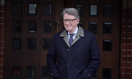 Peter Mandeslson outdoors in a coat, smiling